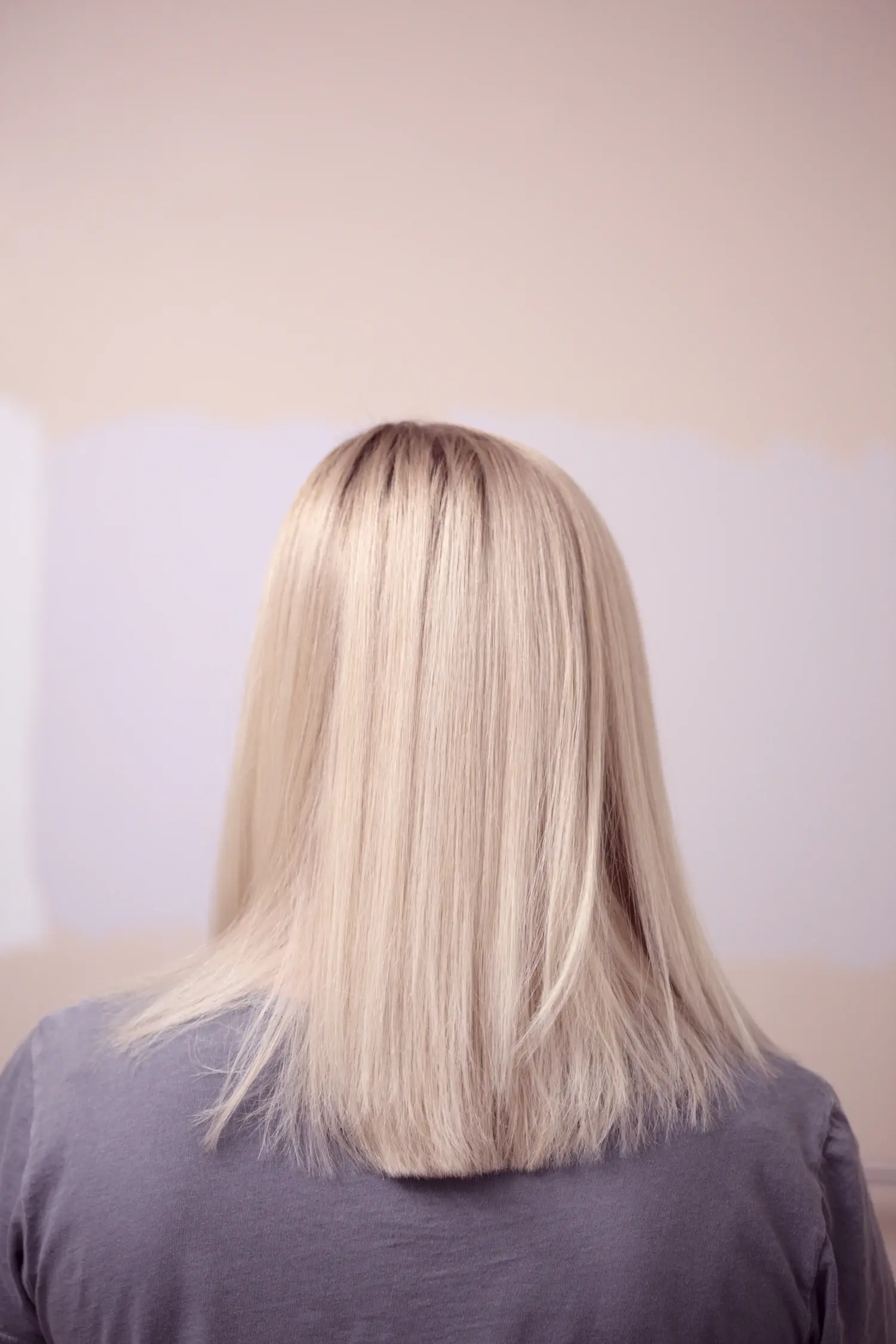 Long, sleek platinum blonde hair — advanced blonding result